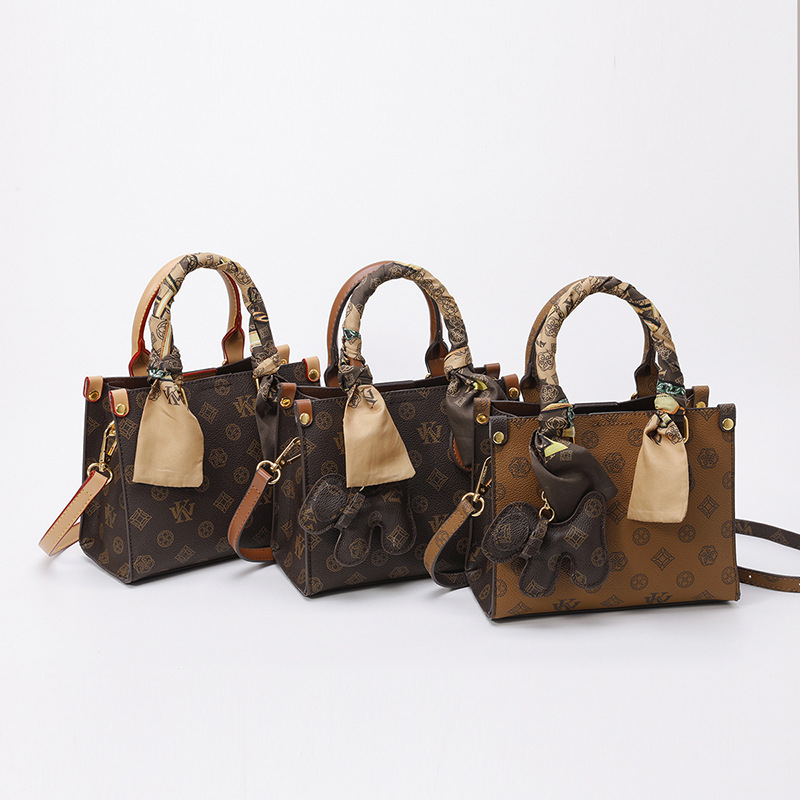 Bolso de impresión retro 2024 invierno nuevo bolso de tendencia temperamento de moda versátil hombro alto sentido ligero bolso de lujo de mujer