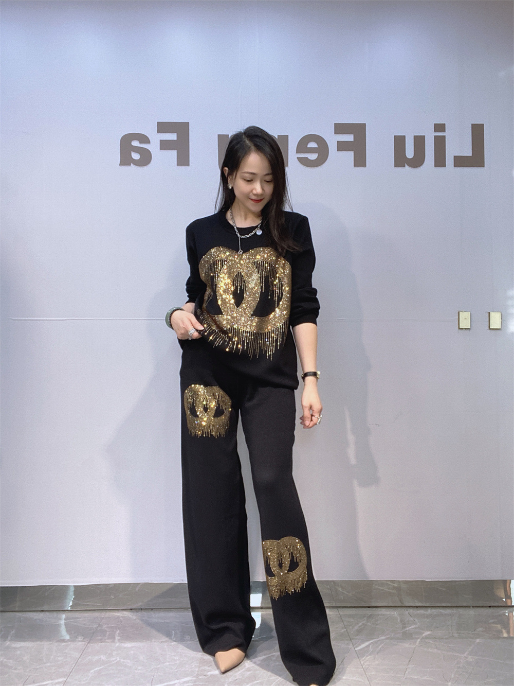 Industria pesada de diamante de agua transfronteriza ropa de mujer de moda europea y americana camiseta de punto de dos piezas para mujeres primavera y otoño pantalones casuales de piernas grandes set