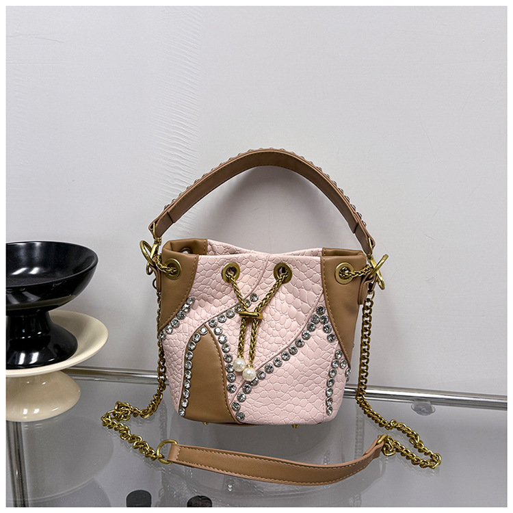 Bolso de cubo de comercio exterior mujer 2026 nuevo nicho transfronterizo ligero de lujo empalmado cadena de diamantes bolso de hombro