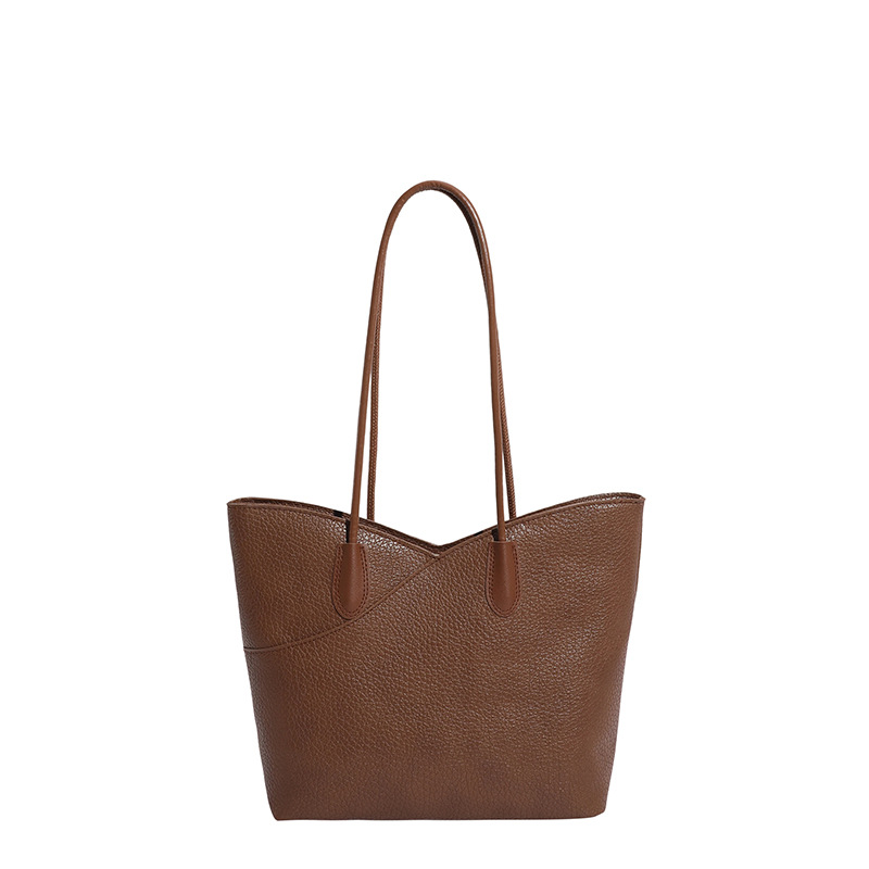 Bolsa de mano de textura superior para mujeres 2026 nicho transfronterizo bolso de hombro ligero de lujo de gran capacidad de viaje a la braza