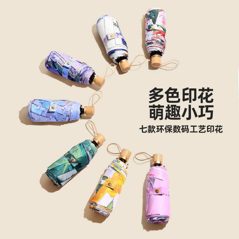A small and portable, dual-layer, reversible, black rubber sun umbrella with a five-fold design, offering shade, sun protection, and UV defense, suitable for both sunny and rainy days, for women.