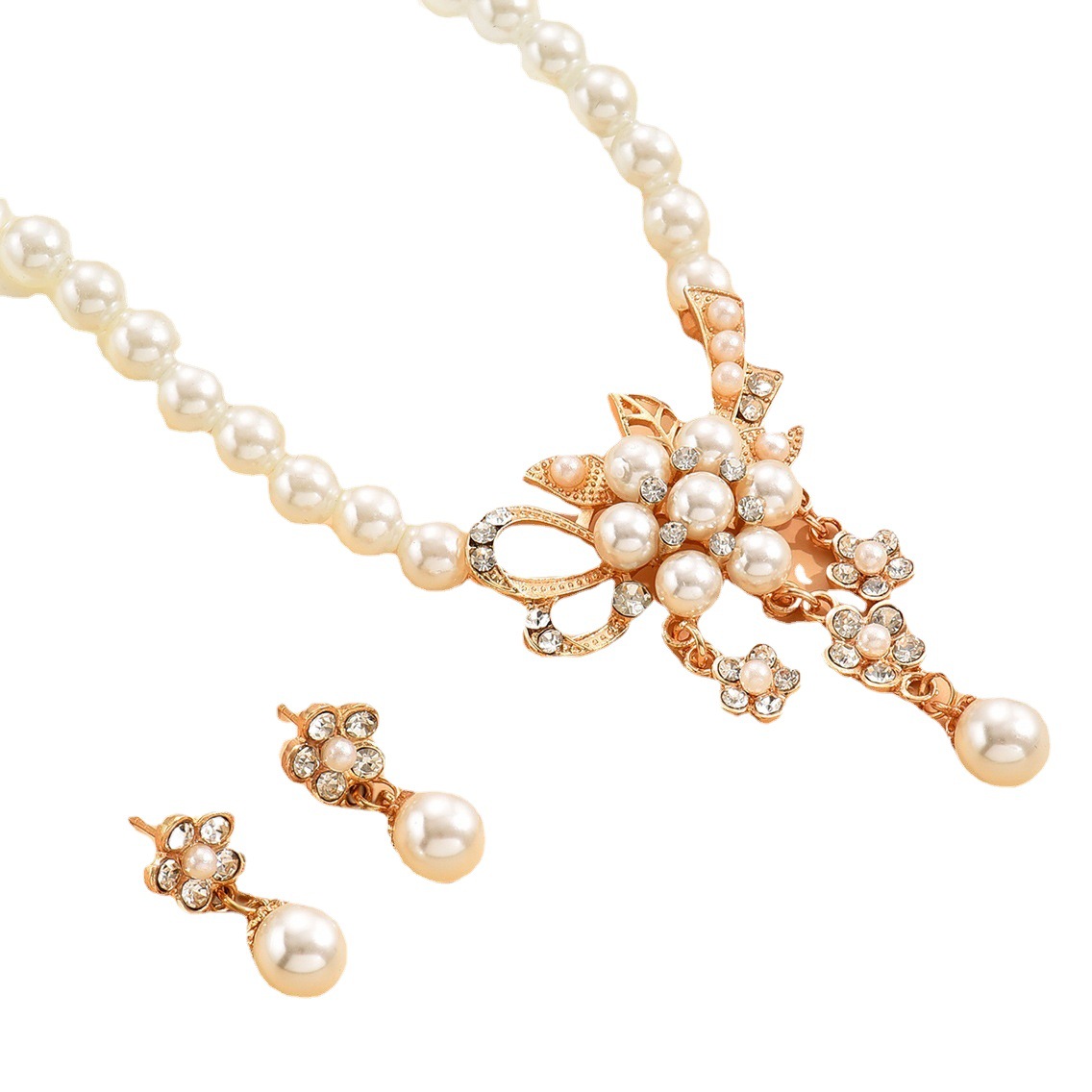 Venta caliente transfronteriza europea y americana marca nueva moda perla flor collar pendientes traje joyería femenina aleación galvanizada oro rosa