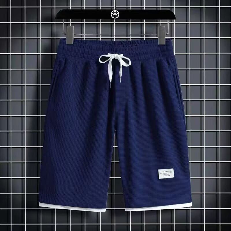 Camisa menos ropa Waffle pantalones de cinco puntos para hombres verano nuevo estilo estilo Hong Kong pantalones cortos de dos piezas falsos de color recto suelto