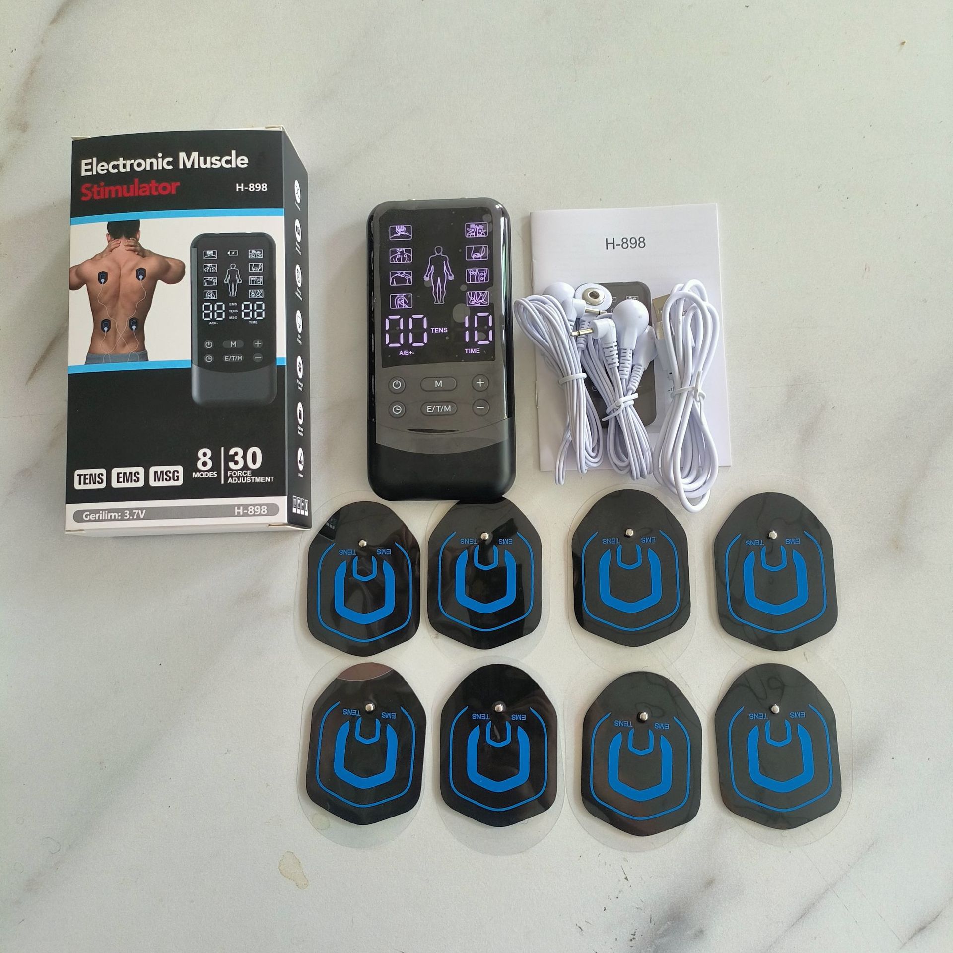 Host * 1 + un cable de cuatro botones * 2 + 8 piezas de parche (4 pares) + cable de carga USB + caja de color + instrucciones de idiomas de ocho países