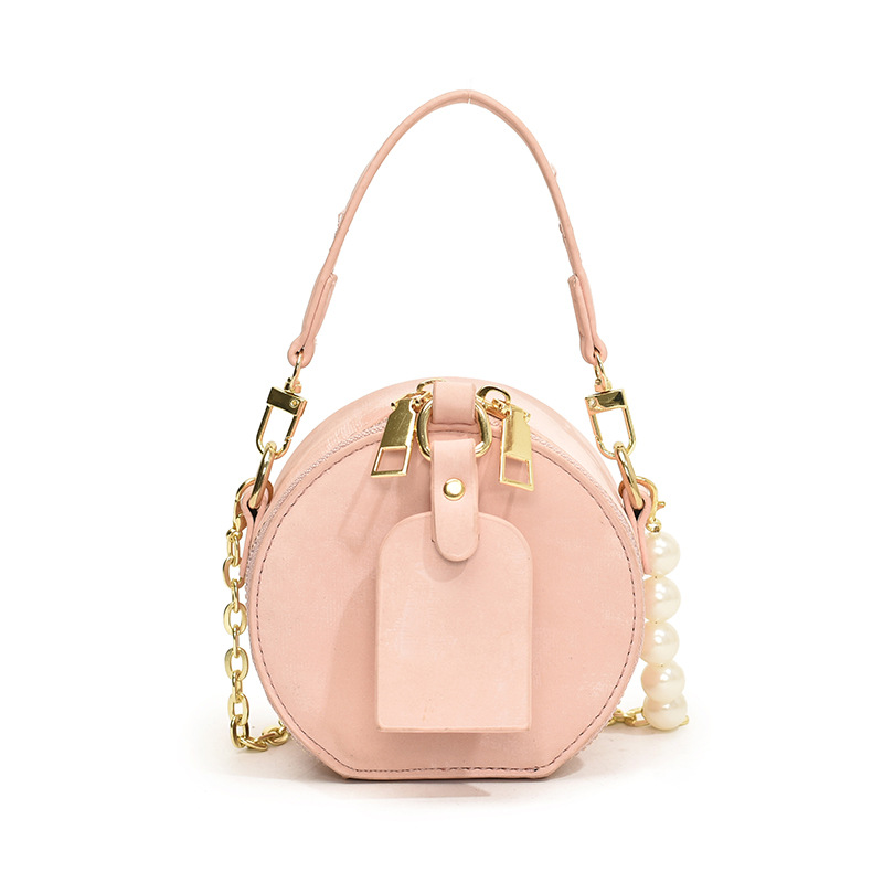 Bolsa de hombro coreana para niños y niñas de color sólido de perlas extranjeras mini bolso para bebés 2025 nueva cadena bolso para niños