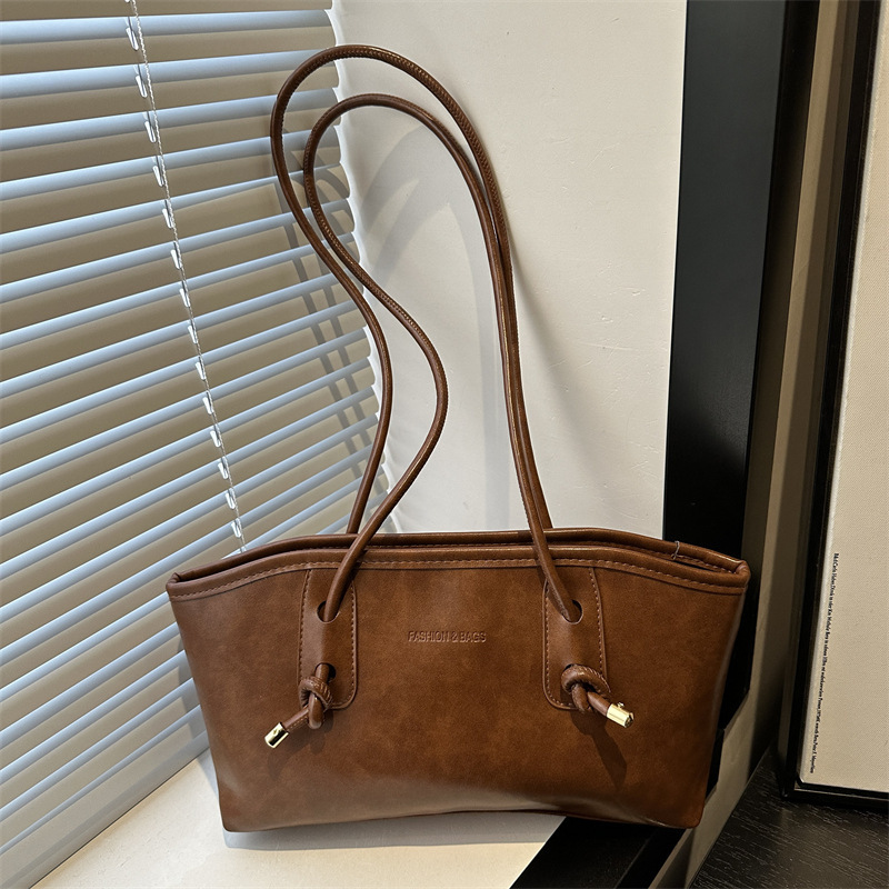 Commuting mujeres de color sólido 2024 nuevo otoño invierno retro moda texturas colgantes casuales de hombro bolso