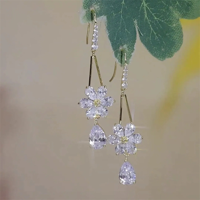 2023 nuevo gancho para la oreja de todo fósforo, pendientes de gota de agua, pendientes de temperamento, lujo ligero, moda de alta gama, pendientes de flores de circón, mujeres