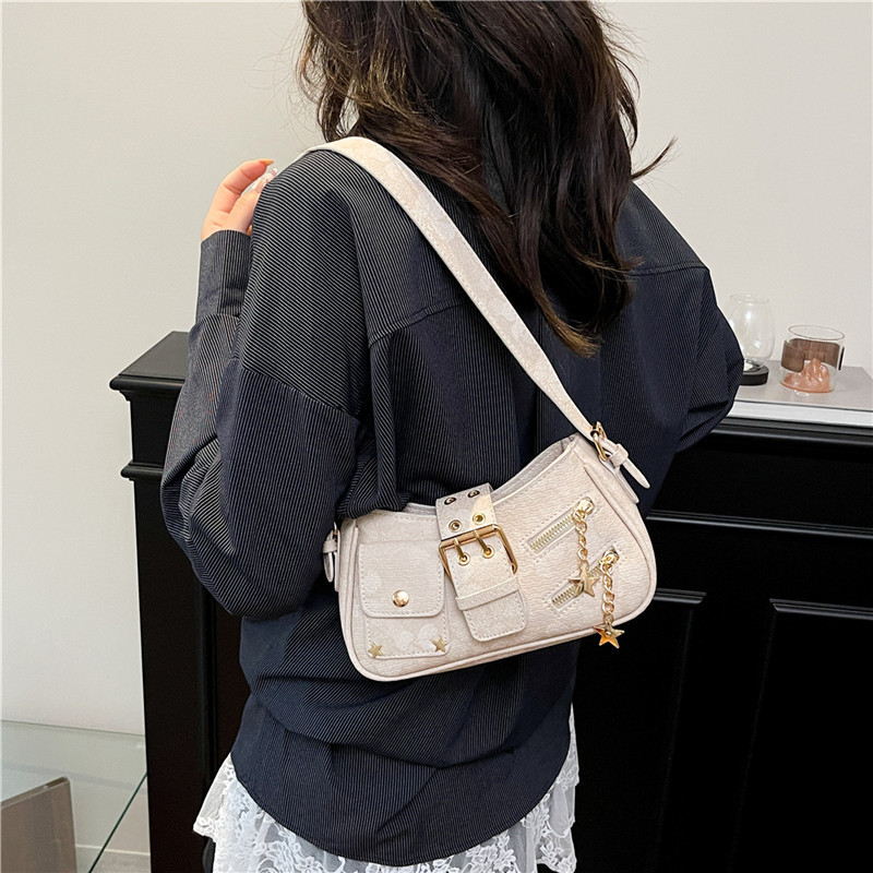 Dulce y fresco bolso de axila de chica caliente 2025 verano nuevo bolso femenino diseño de nicho bolso de hombro flor oscura bolso de mensajero marea