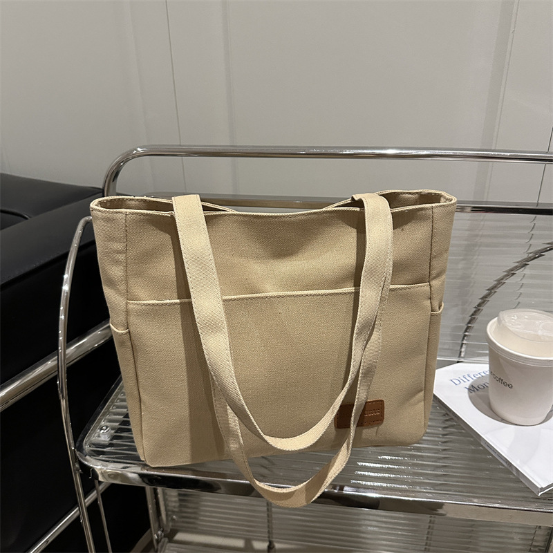 Bolsa de lona de alta capacidad para mujeres japonesas simple versátil bolso de hombro de viaje de estudiantes bolso especial