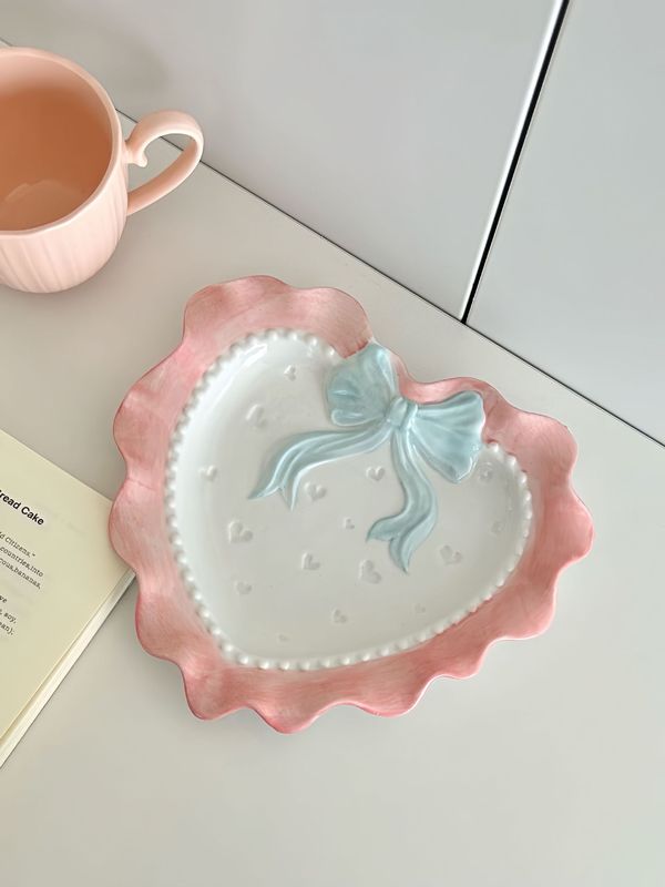 かわいい波の辺の蝶結びの愛の陶磁器のレースの食器の少女の心の家庭の茶碗の皿のドーパミンの食器|undefined