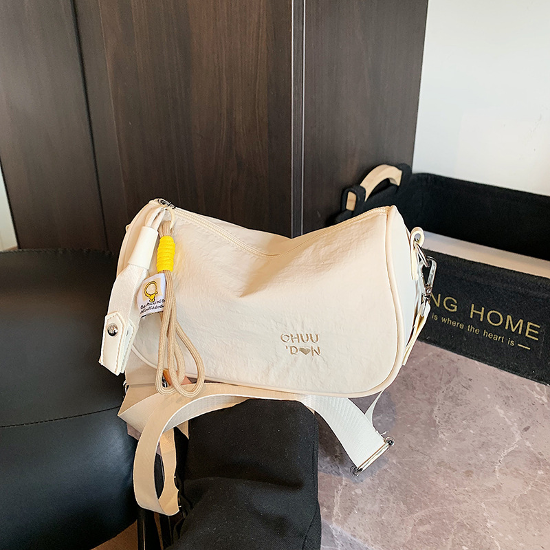 Bolso de lona de moda coreana 2025 verano nuevo bolso femenino con letras bordadas bolso de hombro casual bolso de mensajero con correa de hombro ancha