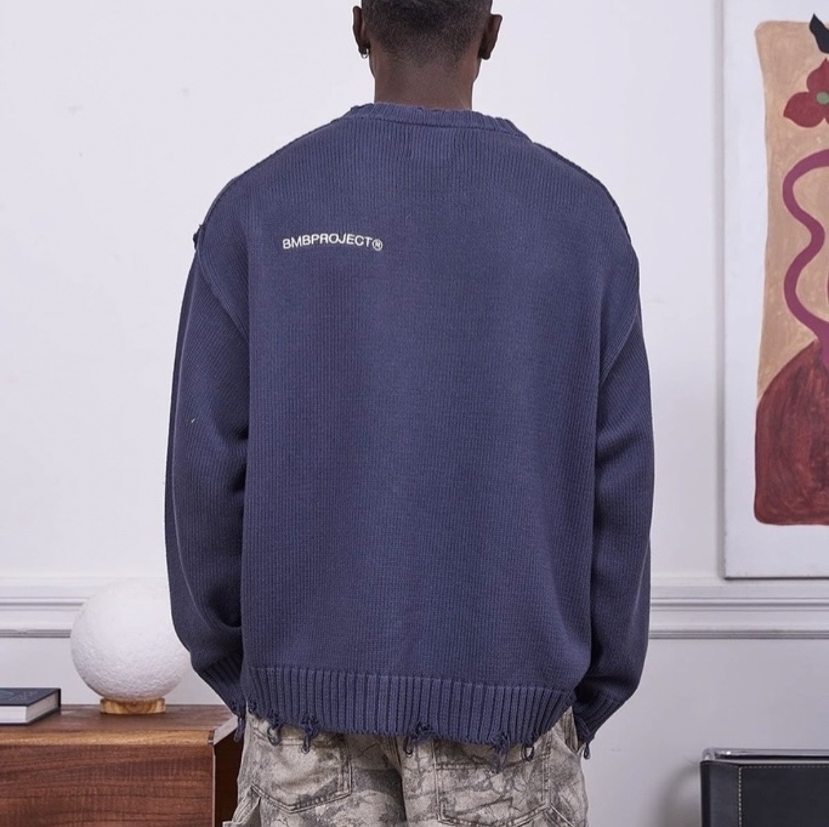 Estación independiente europea y americana otoño e invierno suéter rasgado hombres y mujeres costura de cuello redondo marca de moda retro suéter suelto casual