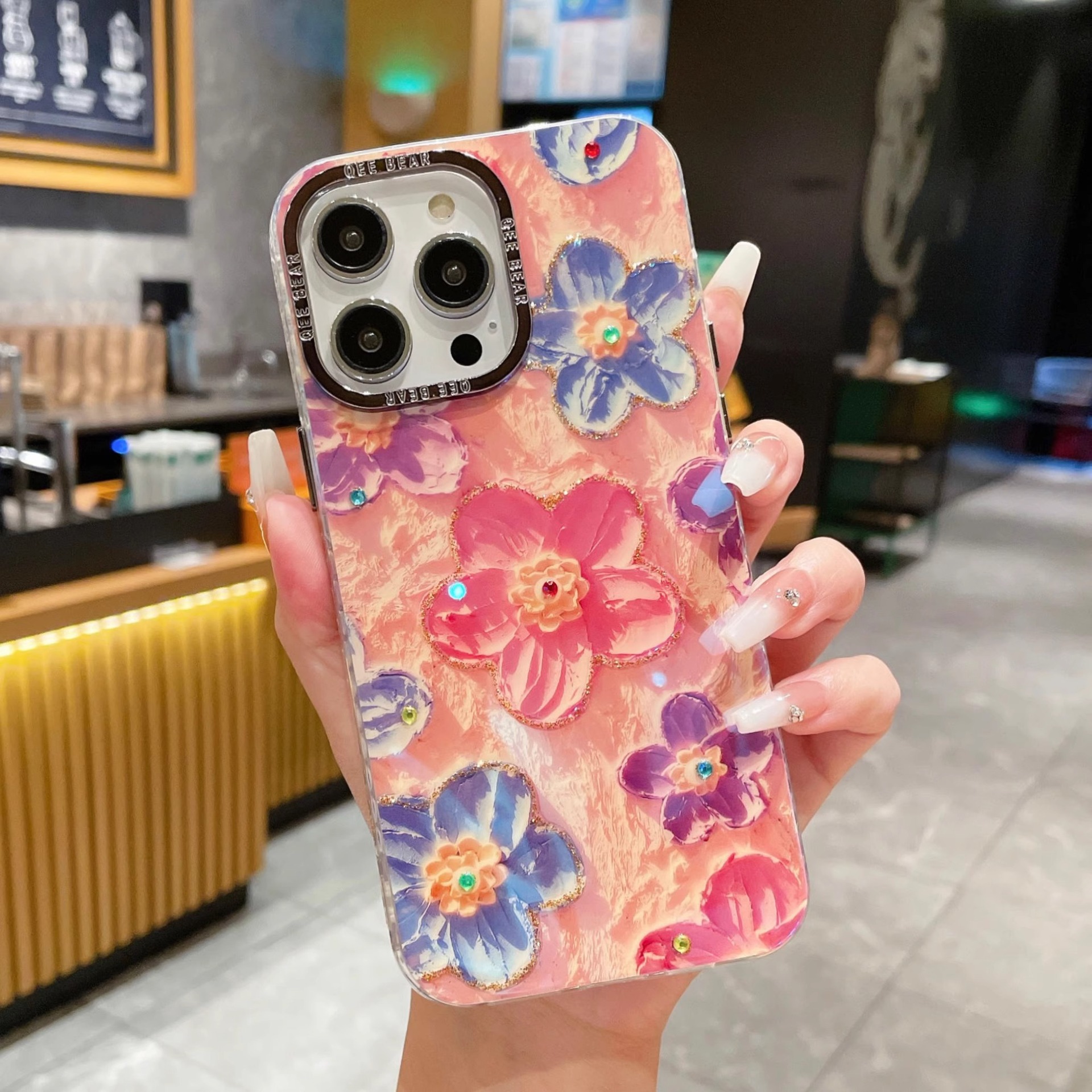Marco metálico compatible con la funda del teléfono Apple 15, iPhone 17 Pro, resina azul claro, pintura al óleo de arcoíris, pulsera con diseño de flores