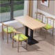 A table of four chairs log color fruit green cushion