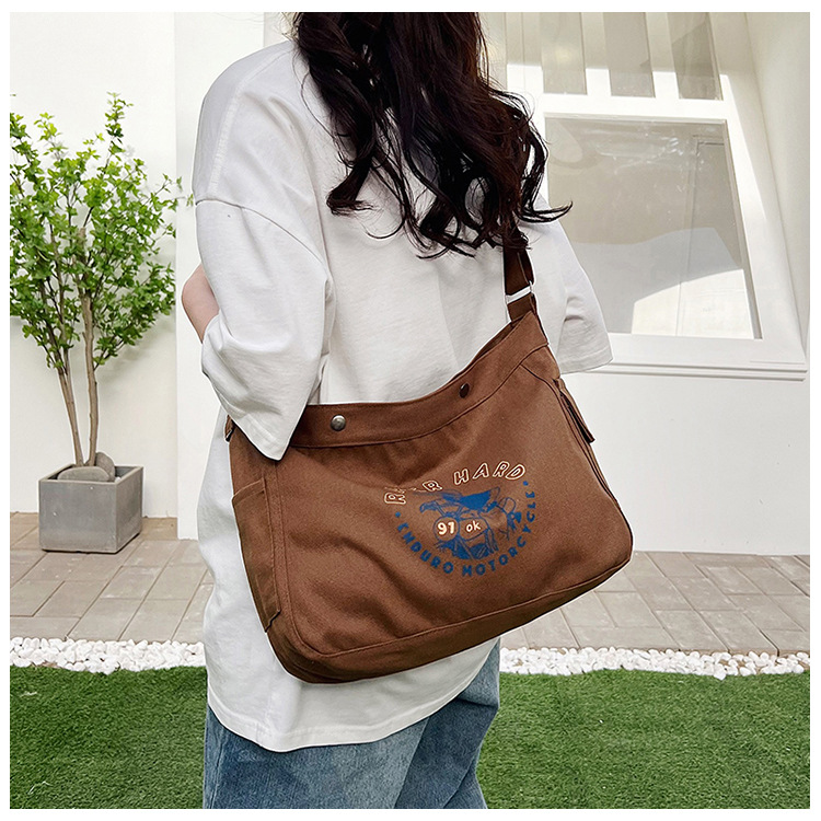 Wholesale large-capacity casual commuting women's single-shoulder bags, Korean-style trendy and fashionable handbags, LOGO printed canvas bags undefined