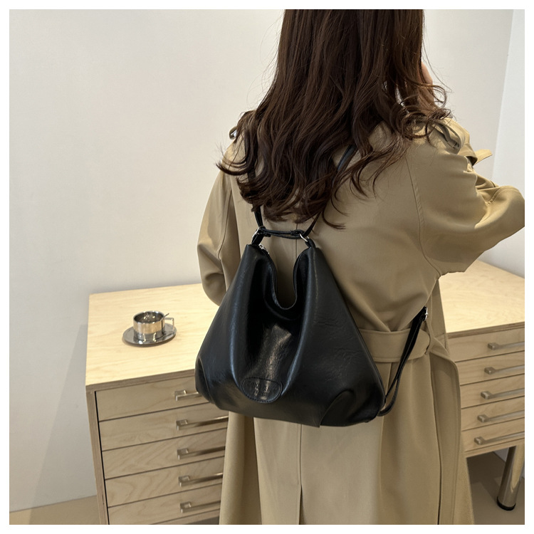 The 2024 new pleated tote bag is a large-capacity casual and fashionable backpack for women, featuring multi-functional texture and a single-shoulder crossbody bag undefined