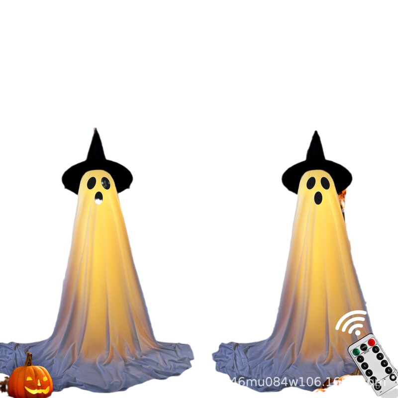 前の玄関に帽子をかぶって光る幽霊ハロウィーンは鬼の玄関の庭の幽霊ハロウィーンの装飾を立てます。|undefined