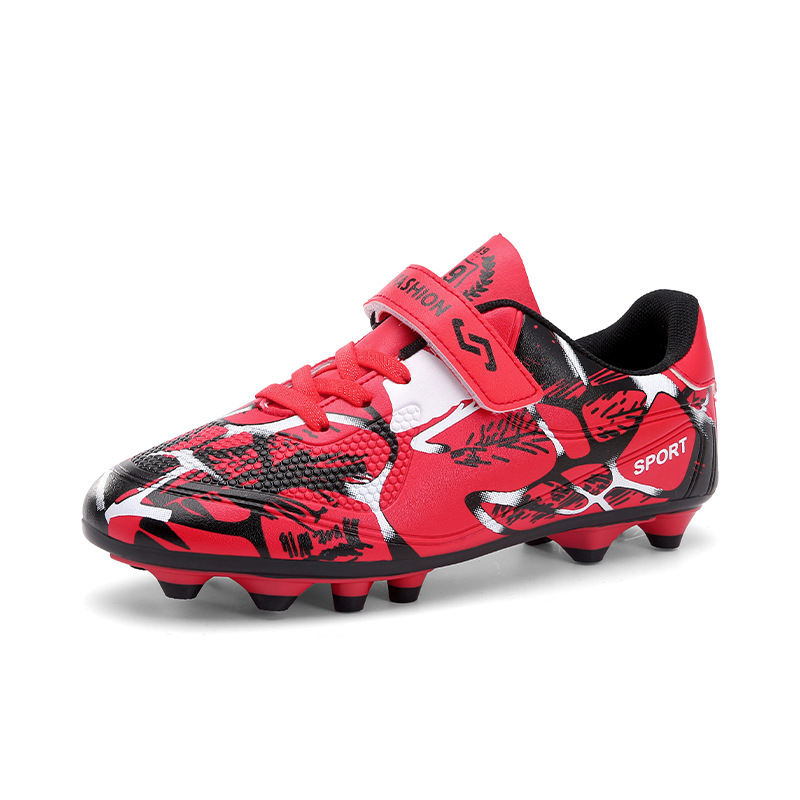 Nuevo transfronterizo niños y niñas transpirables cómodos deportes ociosos bajos clavos largos competencia de césped fabricantes de zapatos de fútbol de estudiantes
