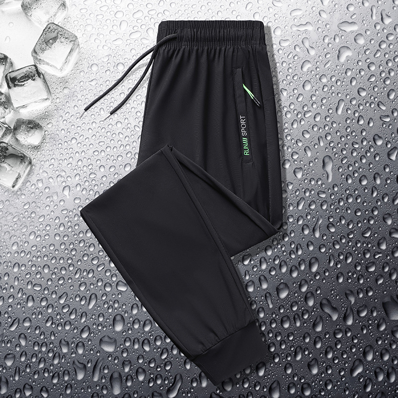 Pantalones deportivos casuales de seda de hielo para hombres pantalones de verano finos de punto de oro elásticos de secado rápido casuales atados al tobillo más pantalones de tamaño