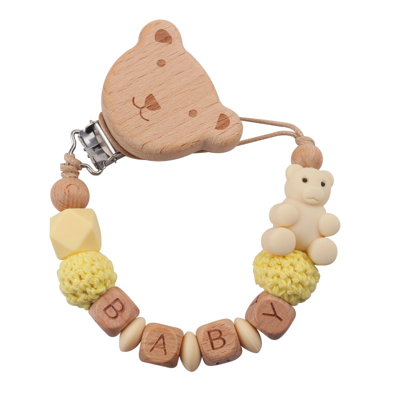 Nuevos productos para la madre y el bebé, clips de oso de haya, juguetes de dientes apretados para bebés, cadena de chupete de oso de oso de animales de dibujos animados