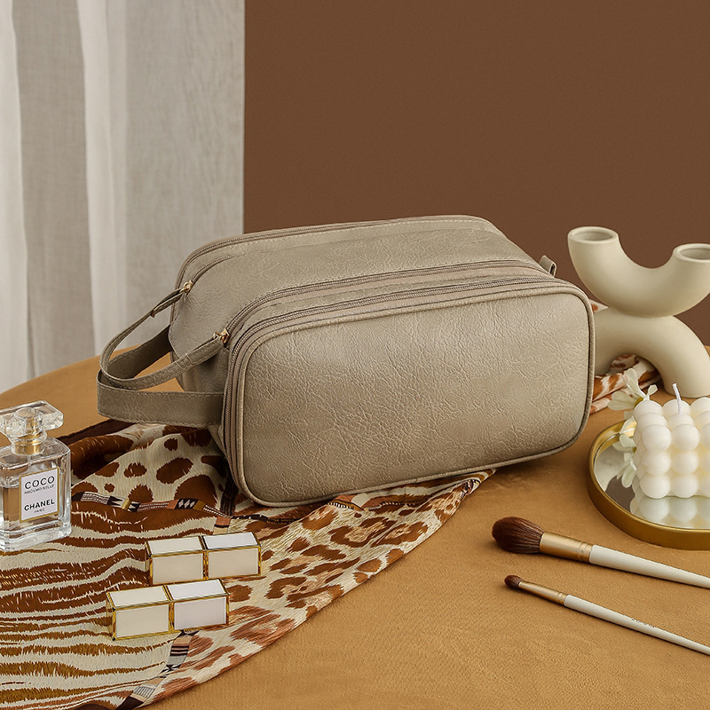 2025 nueva bolsa de maquillaje portátil de almacenamiento de gran capacidad de viaje de mujeres bolsa de lavado de lavado cepillo de maquillaje bolsa de escritorio