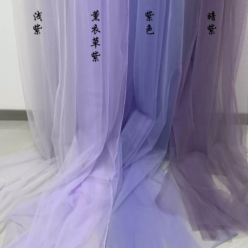 Purple and light purple sheer fabric, used as a wedding backdrop, reception curtain, waterfall drape, or for decorating beauty salons, event stages, and rooms Purple and light purple sheer fabric, used as a wedding backdrop, reception curtain, waterfall drape, or for decorating beauty salons, event stages, and rooms