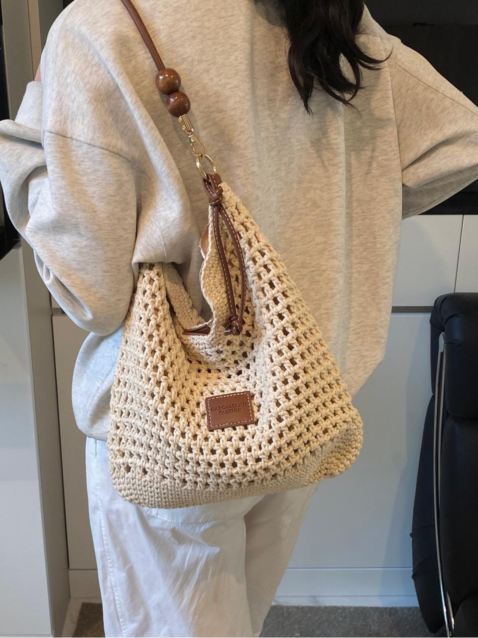 Bolso tejido hueco, verano femenino, nuevo estilo, bolso tejido de paja, bolso de mensajero de un solo hombro de gran capacidad, bolso de playa de vacaciones junto al mar