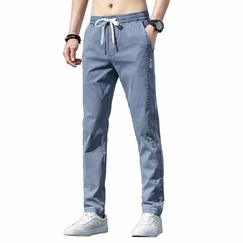 Primavera y verano jeans finos hombres sueltos rectos adolescentes pantalones largos delgados coreanos pantalones de negocios de marca de moda