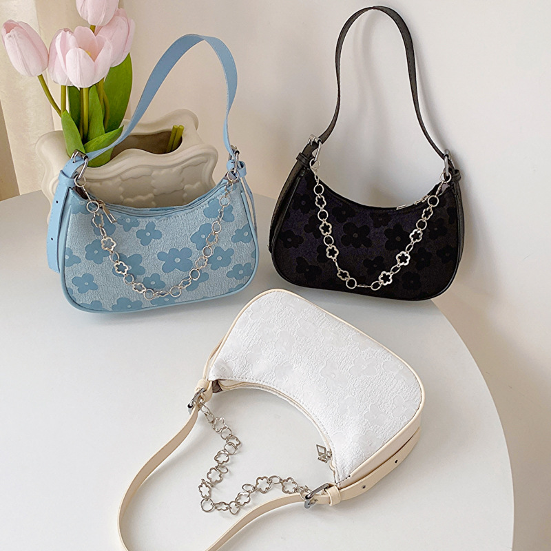 Bolso de las axilas para las mujeres 2023 nuevo bolso de mensajero de hombro de moda nicho retro ins baguette bolsa de tela tejida de encaje