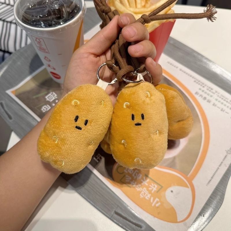 Harbin sur pequeña patata peluche colgante bolsos muñecas muñecas lindas muñecas máquina peluche al por mayor chirrido