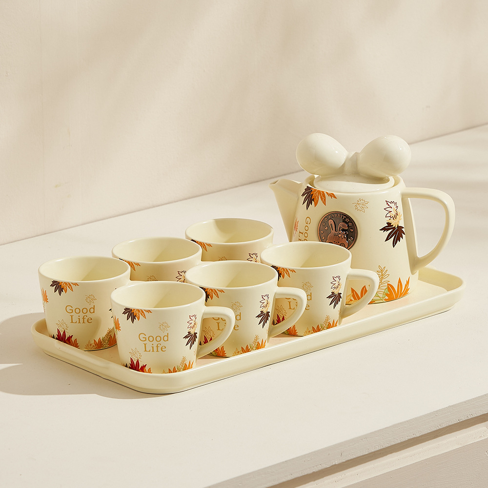 INS tetera cerámica hogar creativo Parche pequeño fresco Kung Fu flor tetera lindo filtro resistente al calor agua fría