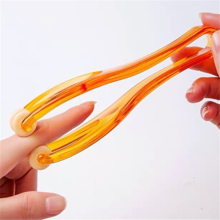 Spot al por mayor masajeador de dedos, rodillo de acupuntura para articulaciones, masaje de manos hermosas, clip de masaje de pulgar, regalo creativo