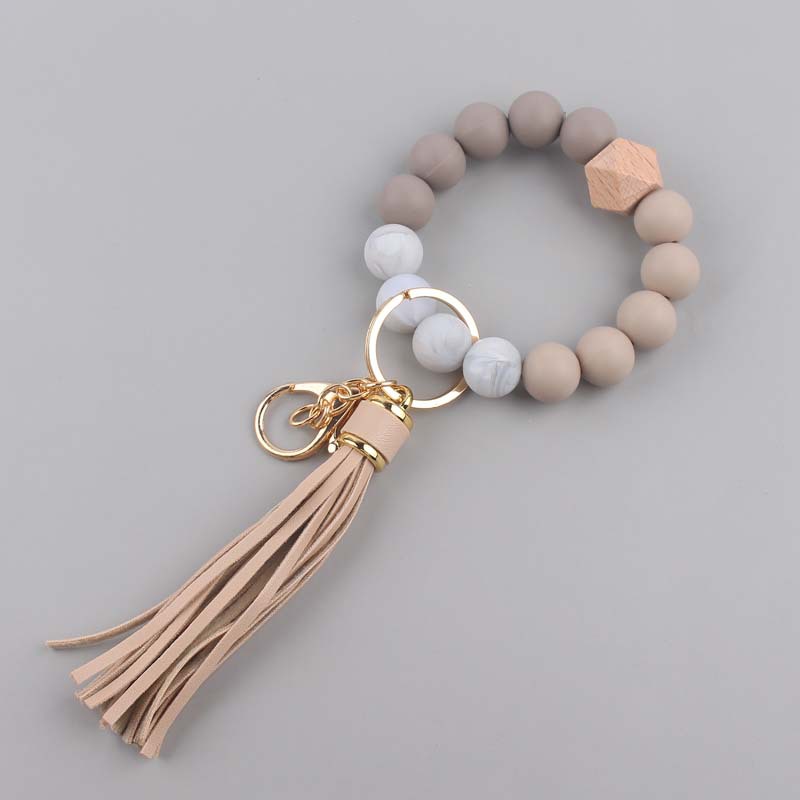 Nuevo cuero creativo pu borla colgante silicona muñeca llavero colgante silicona cuentas pulsera llavero
