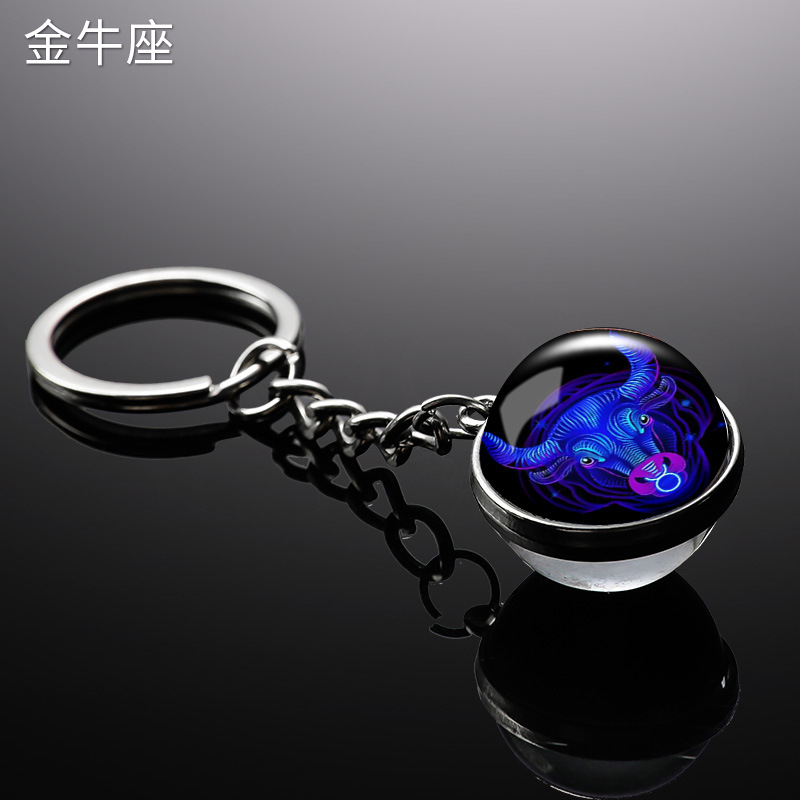 Transfronterizo 12 constelaciones de luz nocturna bolsos colgantes de bolsas de joyas de tiempo doble cara bola de vidrio llavero al por mayor