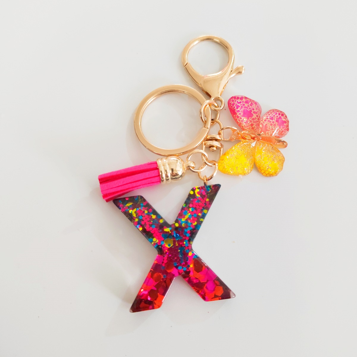 Ventas transfronterizas calientes de letras inglesas de color mixto colgante de llavero colgante de mariposa fringe de resina de llavero colgante de joyería