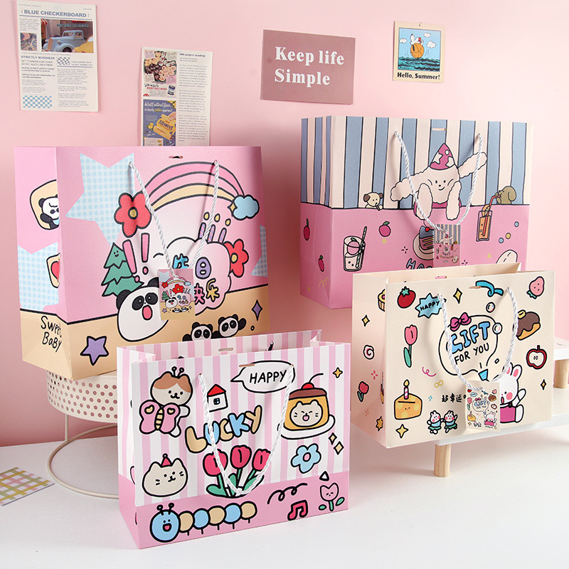 Bolsas de regalo de dibujos animados en bolsas de regalo de mano de tarjeta blanca bolsas de regalo de mano de estudiantes bolsas de regalo de mano