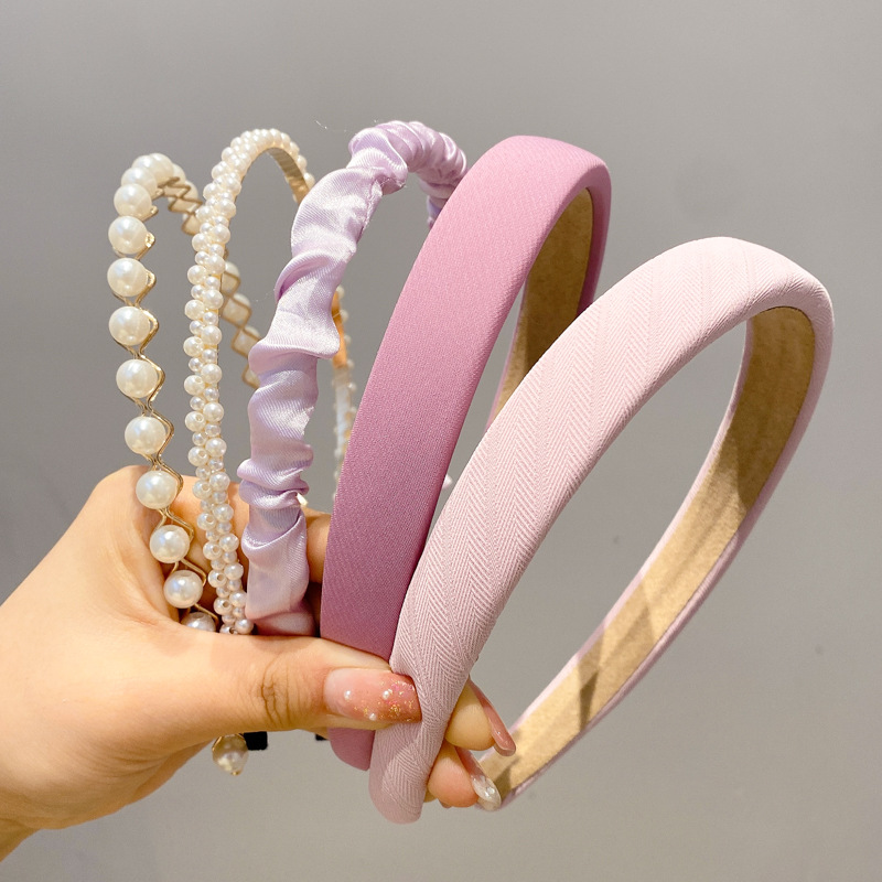 A principios de la primavera, la banda de cabello para mujeres en línea, 2025 nuevo lavado de cara de presión de tarjeta de cabello para el cabello, banda de cabello de perlas, banda de cabello para mujeres.