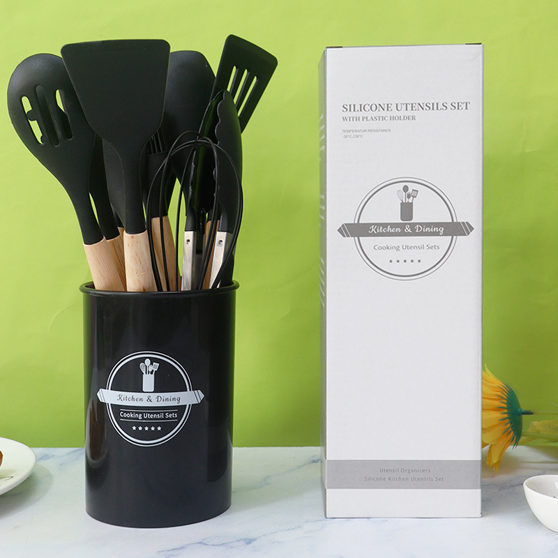 Utensilios de cocina de silicona transfronterizos 12 piezas sartén antiadherente pala de silicona de grado alimenticio espátula de silicona cuchara de sopa traje en stock al por mayor