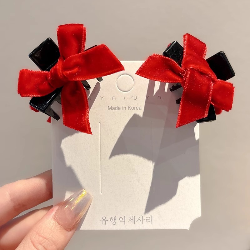 1 par de arcos rojos flocados.