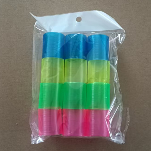 子供の魔力の虹の輪の表情の笑顔の虹のスプリングの輪の露店の弾力の積み重ねの輪の知育のノスタルジックなおもちゃ|undefined
