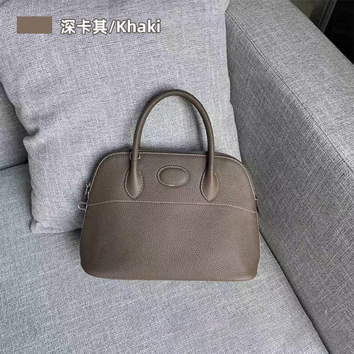 New Arrival Litchi-Grain Genuine Leather Bowling Ball Shell Bag  
Premium Full-Grain Cowhide Tote with Zipper Closure  
Spacious Casual Women's Handbag