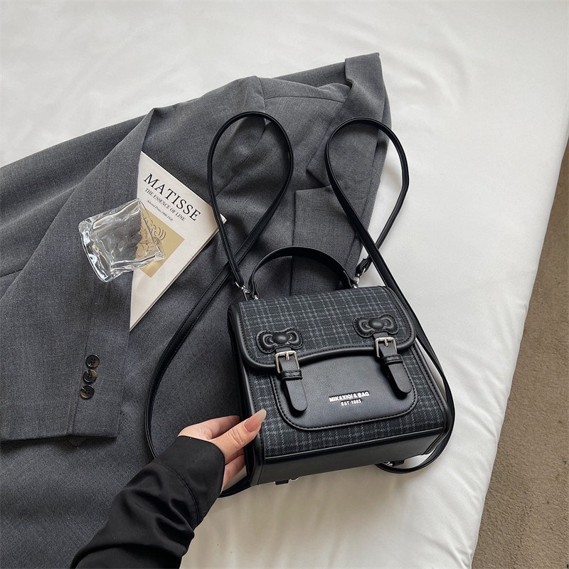 Mochila universitaria popular para estudiantes mochila casual de mujer estilo a cuadrícula nicho 2026 escuela de moda de verano nuevo estilo