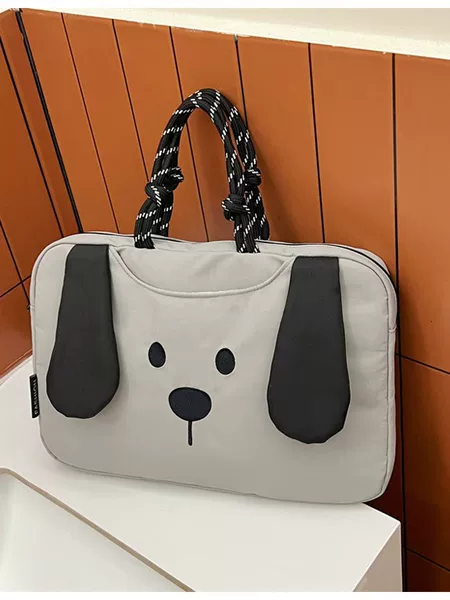 Portable, fleece-lined, shockproof laptop bag with a cartoon design, featuring colorful painted leather and a waterproof storage compartment