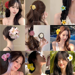 リゾート風の花は純粋に胡蝶蘭の側の髪を染めたいです。女性の高級感のある海辺の髪飾りです。