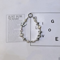 簡約百搭銀色系高級小眾設計感蝴蝶結短款手工串珠包包手機鏈通用