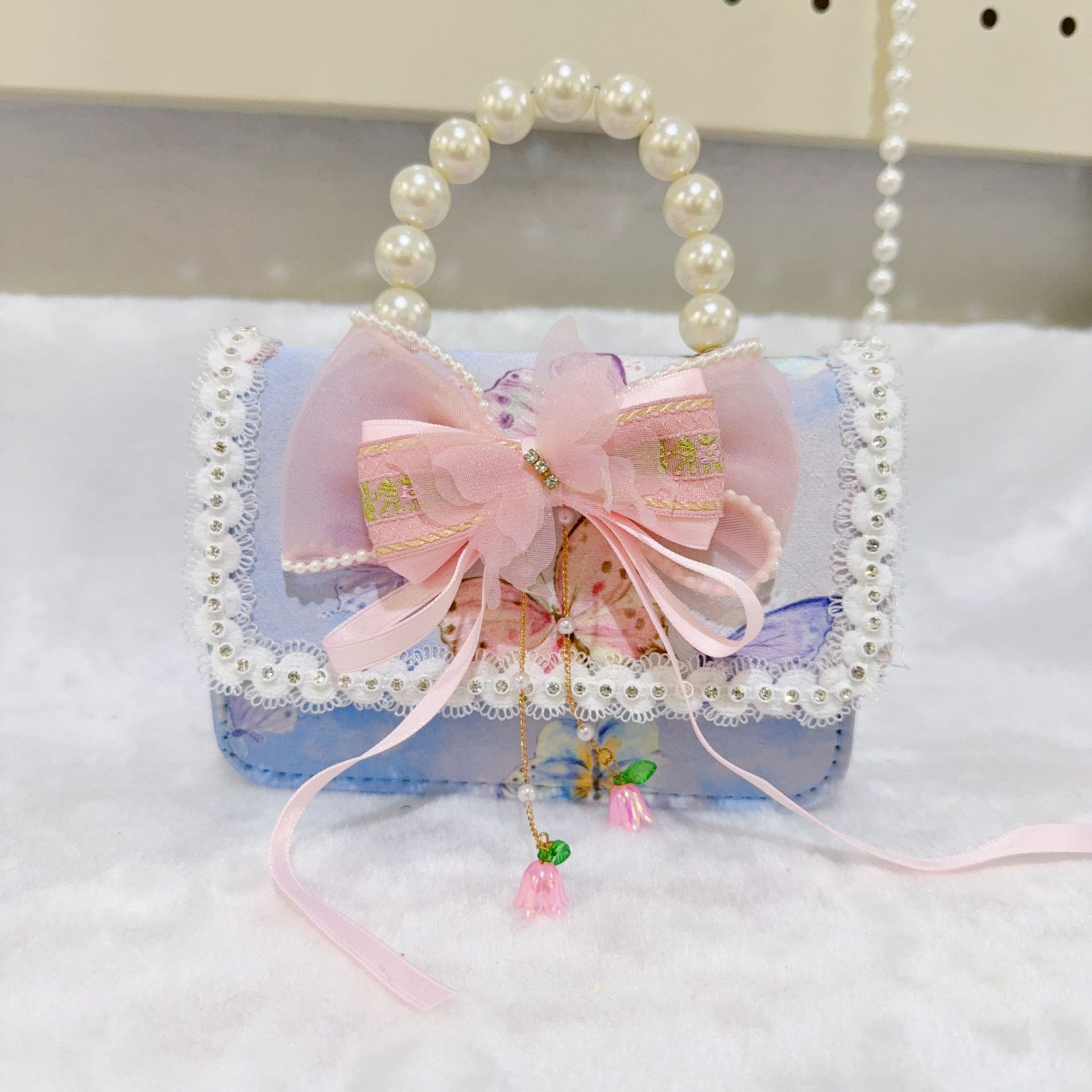 Otoño nuevo bolso infantil princesa perla bolso de mano pequeña fragancia chica bolso de moda bebé portátil
