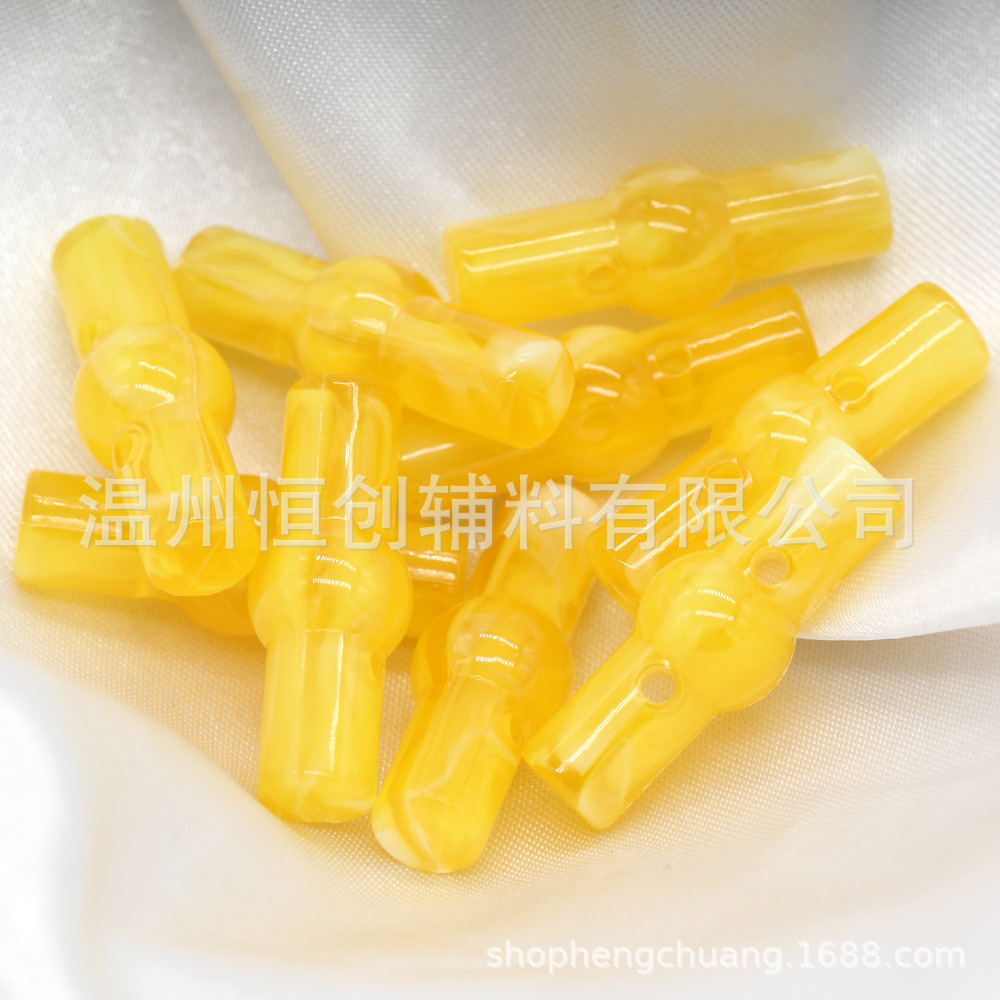 25x9mm brillante Hengchuang botón de resina cilíndrica de dos agujeros botón de estilo nacional suéter de punto botón de color de bricolaje al por mayor