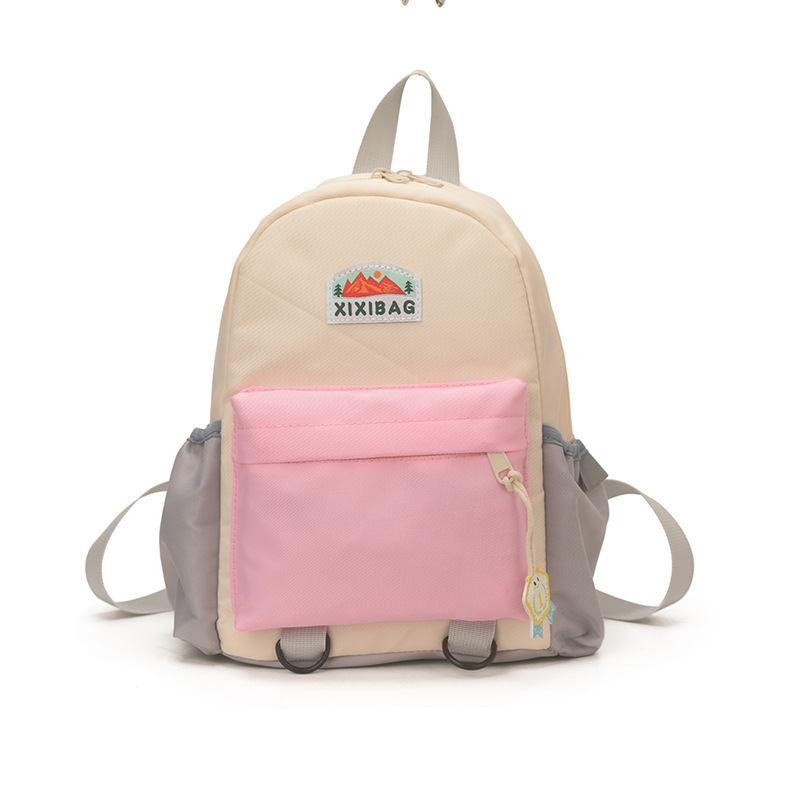 Jardín de infantes para hombres y mujeres, mochila de color extranjero, mochila de estudiantes de primaria de gran capacidad, 2026 nueva mochila infantil transfronteriza