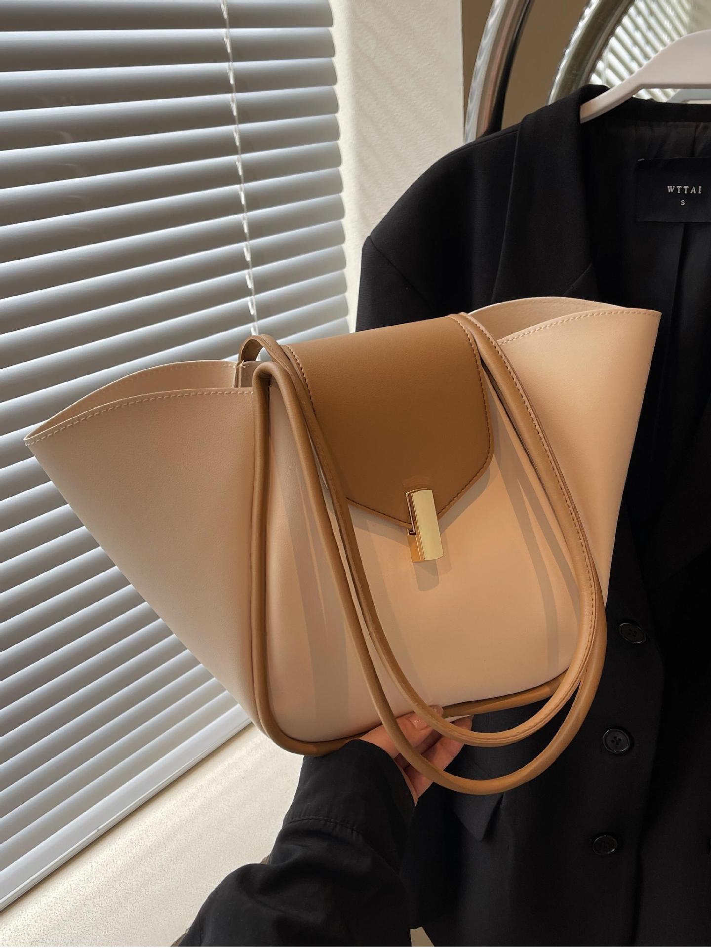 Bolso de cubo de gran capacidad explosivo transfronterizo para mujer 2025 nuevo bolso de hombro casual simple bolso de viaje de cuero suave