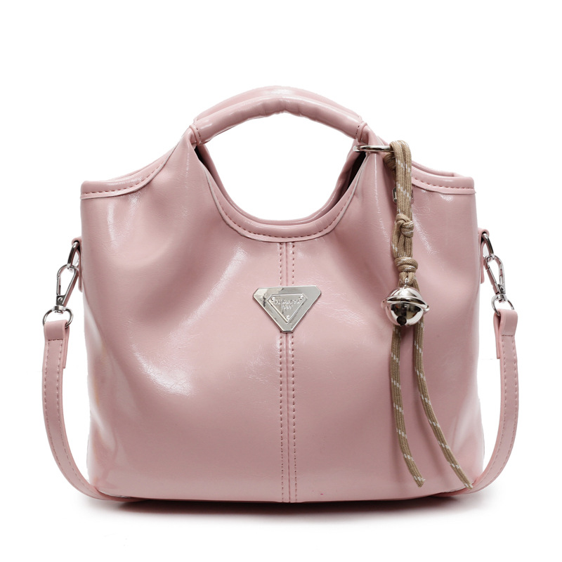 Popular bolso de mano super caliente para mujeres 2025 nueva moda versátil bolso de hombro para viajar bolso de cubo de textura superior